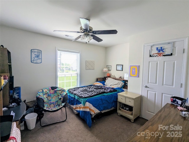 bedroom featuring a ceiling fan, visible vents, and carpet