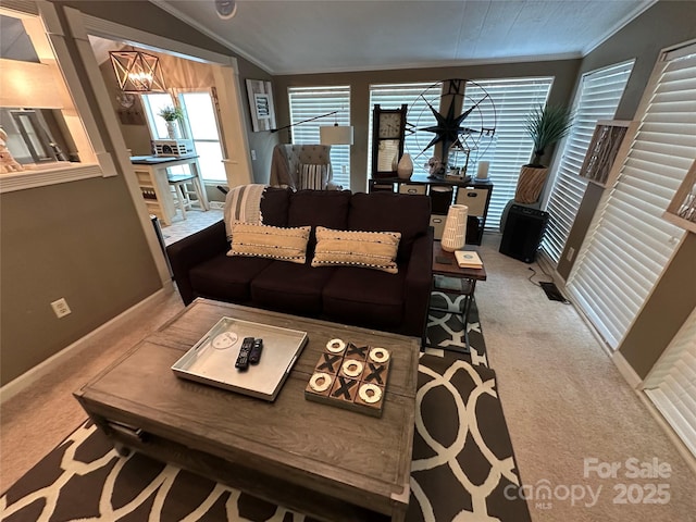 127 Hummingbird Cir, New London, NC 28127 - living area featuring vaulted ceiling, crown molding, light carpet, and baseboards