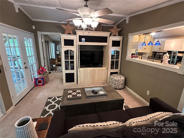 127 Hummingbird Cir, New London, NC 28127 - living area featuring a ceiling fan, light carpet, ornamental molding, and baseboards