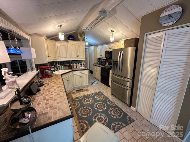 127 Hummingbird Cir, New London, NC 28127 - kitchen featuring a sink, a peninsula, black appliances, vaulted ceiling, and hanging light fixtures