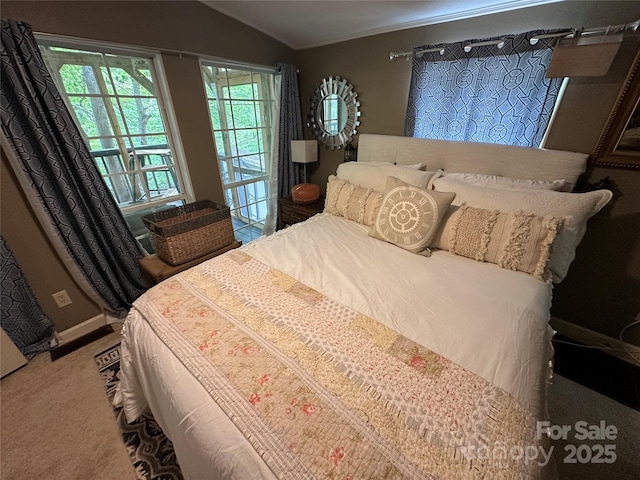127 Hummingbird Cir, New London, NC 28127 - carpeted bedroom featuring baseboards and lofted ceiling