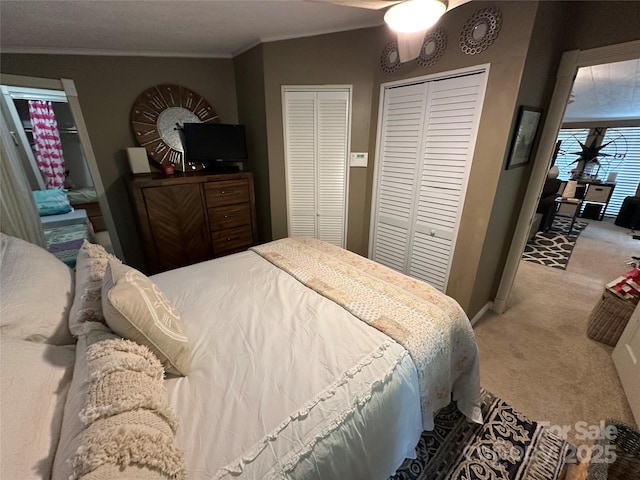 127 Hummingbird Cir, New London, NC 28127 - carpeted bedroom featuring crown molding, baseboards, and multiple closets