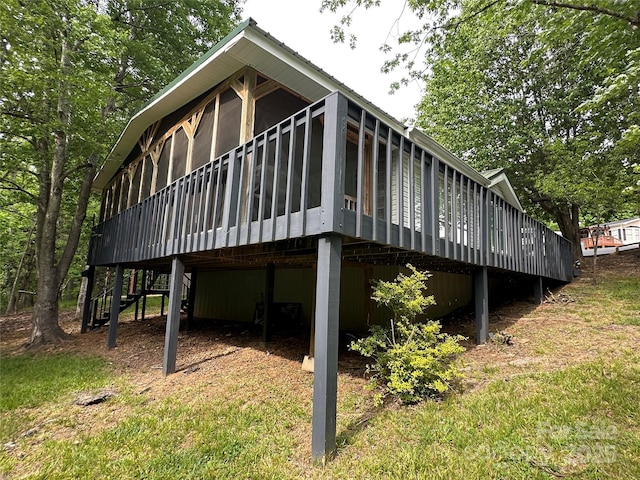 127 Hummingbird Cir, New London, NC 28127 - view of property exterior with stairs, a deck, and a sunroom