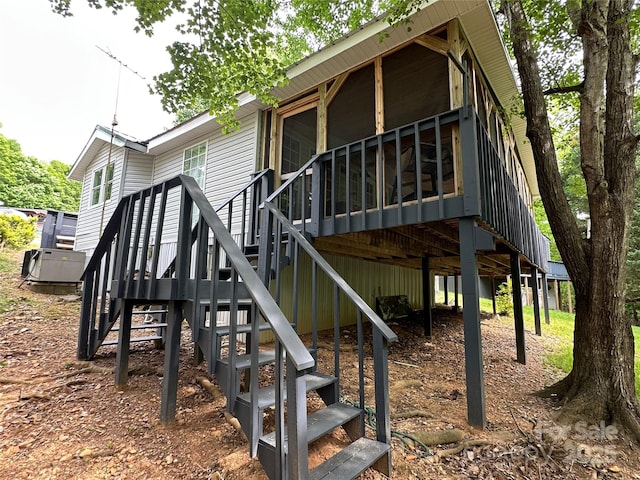 127 Hummingbird Cir, New London, NC 28127 - rear view of property with stairway and a wooden deck