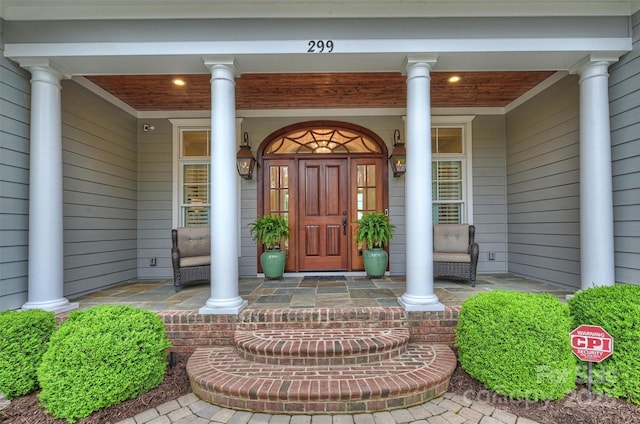 property entrance featuring a porch