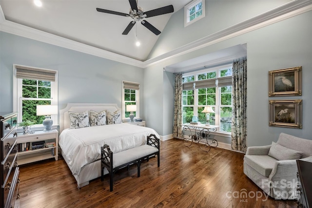 bedroom featuring wood finished floors and multiple windows