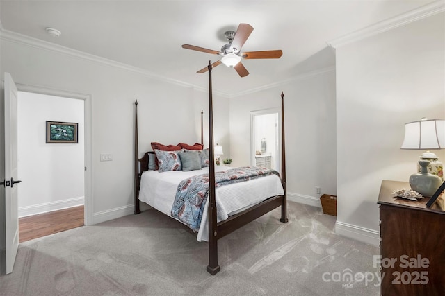 bedroom featuring carpet floors, baseboards, ornamental molding, and ceiling fan