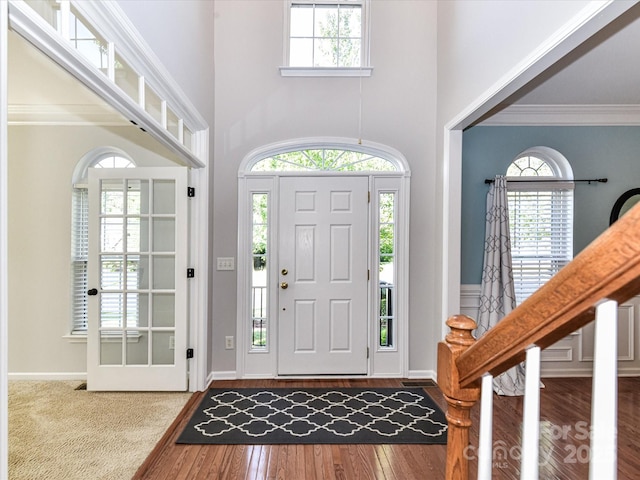 6005 Abergele Ln, Matthews, NC 28104 - entrance foyer featuring crown molding, a towering ceiling, and wood finished floors