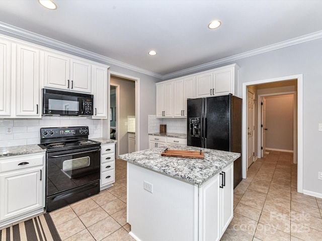 6005 Abergele Ln, Matthews, NC 28104 - kitchen with backsplash, light tile patterned floors, white cabinets, black appliances, and ornamental molding