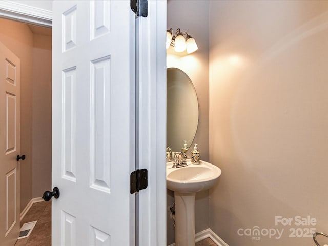 6005 Abergele Ln, Matthews, NC 28104 - bathroom with tile patterned floors, baseboards, and visible vents