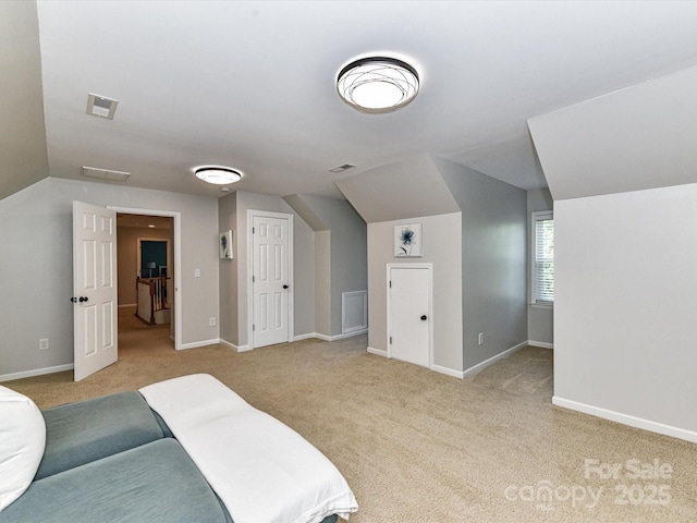 6005 Abergele Ln, Matthews, NC 28104 - carpeted bedroom featuring baseboards, lofted ceiling, and visible vents