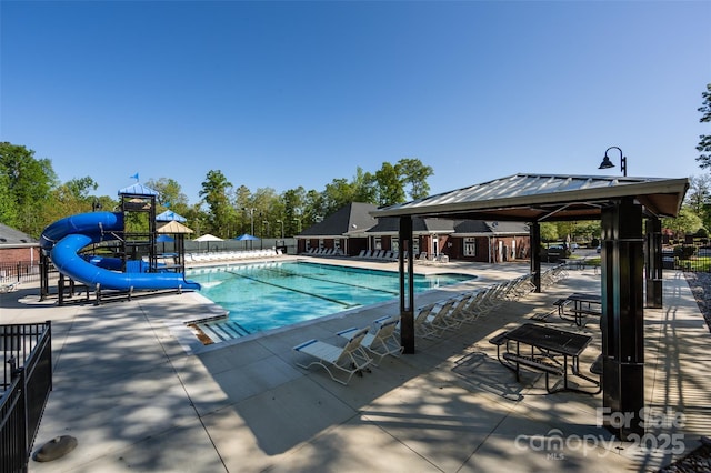 6005 Abergele Ln, Matthews, NC 28104 - community pool with a gazebo, a patio area, a water slide, and fence
