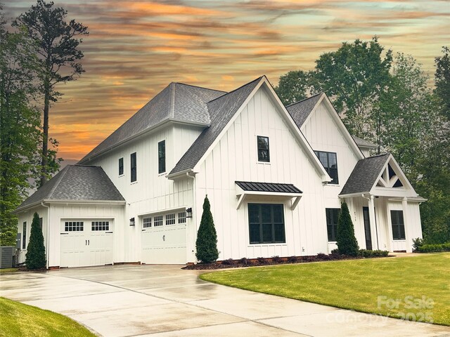 6712 Cove Ln, Sherrills Ford, NC 28673 - modern farmhouse featuring a shingled roof, board and batten siding, driveway, and a yard