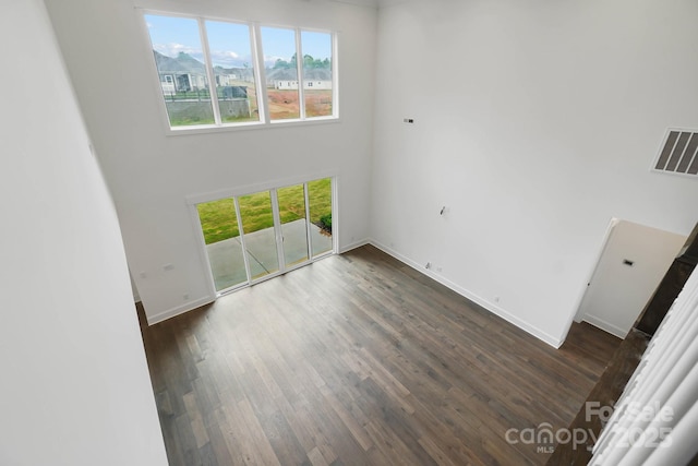 6712 Cove Ln, Sherrills Ford, NC 28673 - spare room featuring plenty of natural light, dark wood-style floors, a high ceiling, and baseboards
