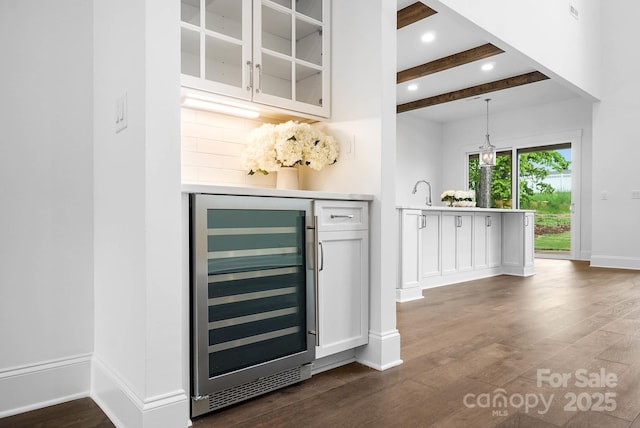 6712 Cove Ln, Sherrills Ford, NC 28673 - bar area with wine cooler, dark wood finished floors, beam ceiling, baseboards, and recessed lighting