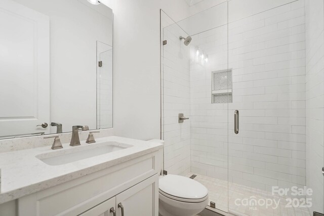 6712 Cove Ln, Sherrills Ford, NC 28673 - bathroom with a stall shower, toilet, and vanity