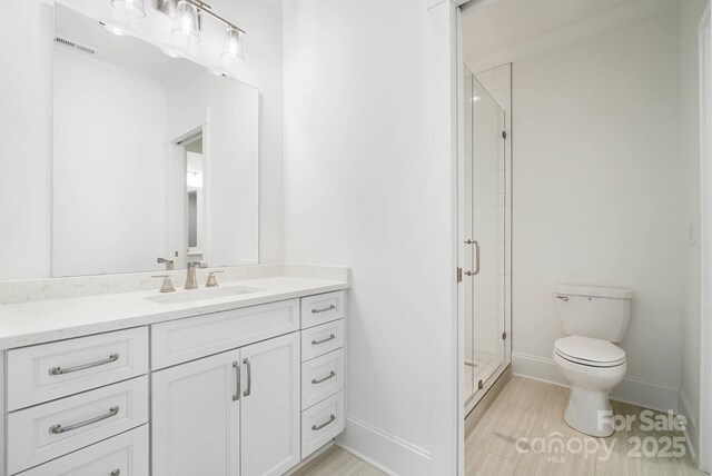 6712 Cove Ln, Sherrills Ford, NC 28673 - full bath featuring vanity, toilet, a shower stall, and baseboards