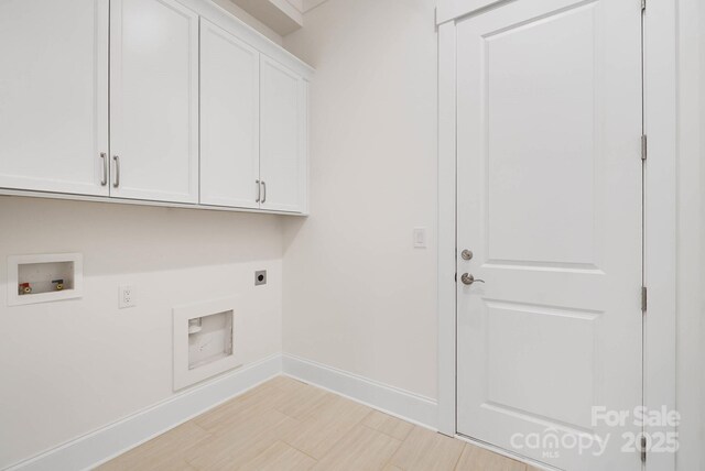 6712 Cove Ln, Sherrills Ford, NC 28673 - laundry area featuring electric dryer hookup, cabinet space, baseboards, washer hookup, and light wood-type flooring