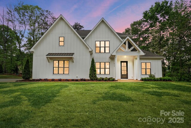 6712 Cove Ln, Sherrills Ford, NC 28673 - modern inspired farmhouse featuring board and batten siding, a standing seam roof, a front yard, metal roof, and roof with shingles