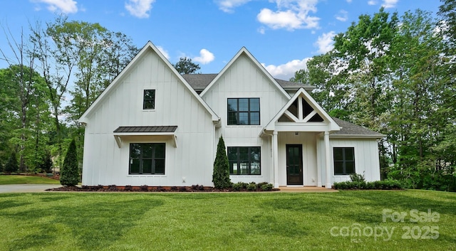 6712 Cove Ln, Sherrills Ford, NC 28673 - modern farmhouse style home featuring board and batten siding, a front yard, a shingled roof, a standing seam roof, and metal roof