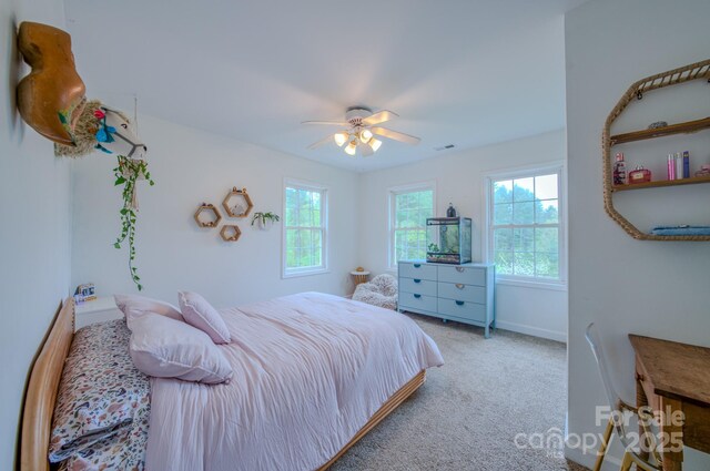 bedroom featuring baseboards, carpet flooring, ceiling fan, and visible vents