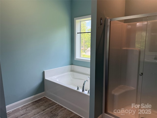 1508 Pennsylvania Ave, Hendersonville, NC 28739 - bathroom featuring a bath, a stall shower, wood finished floors, baseboards, and a sink