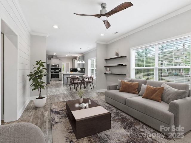 1508 Pennsylvania Ave, Hendersonville, NC 28739 - living room with crown molding, light wood-style floors, a ceiling fan, recessed lighting, and baseboards