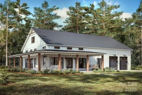 TBD Lindsey Farm Dr, Flat Rock, NC 28731 - back of property with a yard, metal roof, a garage, and board and batten siding