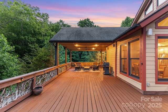 300 Falls View Dr, Lake Toxaway, NC 28774 - deck at dusk featuring an outdoor living space and area for grilling