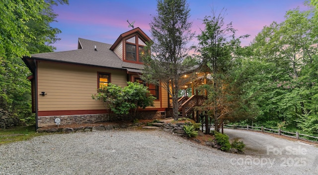 300 Falls View Dr, Lake Toxaway, NC 28774 - view of front of home featuring driveway and roof with shingles