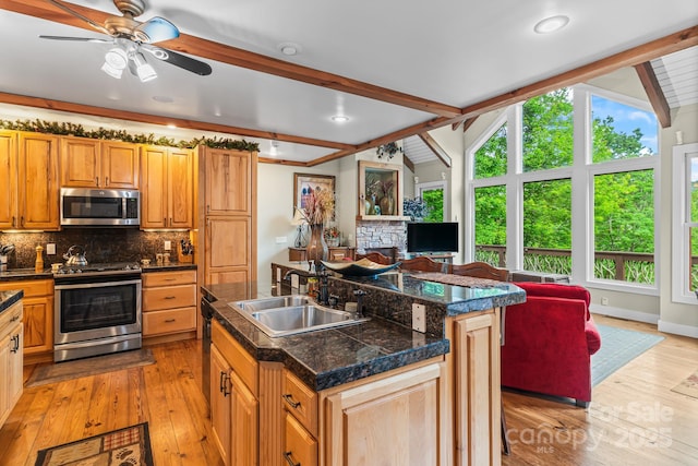 300 Falls View Dr, Lake Toxaway, NC 28774 - kitchen with appliances with stainless steel finishes, healthy amount of natural light, open floor plan, decorative backsplash, and recessed lighting