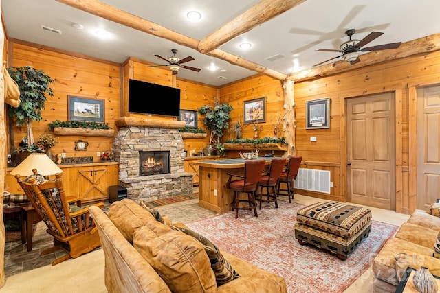 300 Falls View Dr, Lake Toxaway, NC 28774 - living area featuring ceiling fan, beam ceiling, wooden walls, a stone fireplace, and recessed lighting