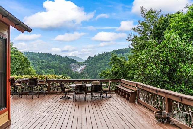 300 Falls View Dr, Lake Toxaway, NC 28774 - deck with outdoor dining area and a forest view