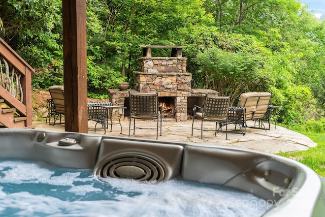 300 Falls View Dr, Lake Toxaway, NC 28774 - view of patio / terrace with an outdoor stone fireplace