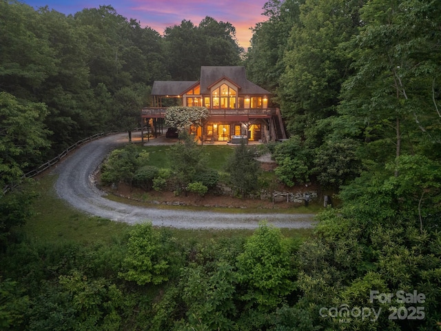 300 Falls View Dr, Lake Toxaway, NC 28774 - rear view of property with a deck, stairs, a forest view, and driveway