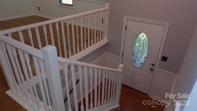 foyer featuring wood finished floors