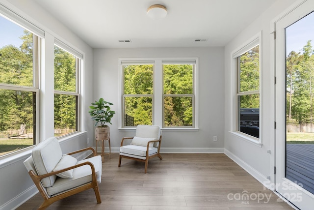 sunroom / solarium featuring visible vents