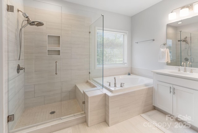 full bath featuring tile patterned floors, a stall shower, a bath, and vanity