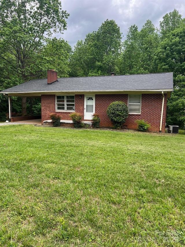 755 Victory Grove Church Rd, Lincolnton, NC 28092 - ranch-style home with brick siding, an attached carport, a front yard, and a chimney