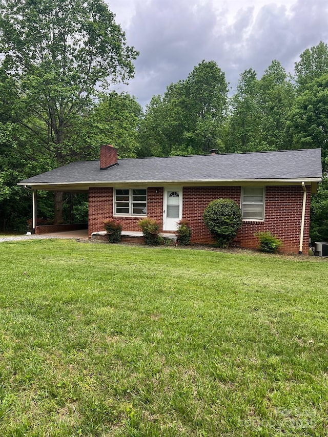 755 Victory Grove Church Rd, Lincolnton, NC 28092 - ranch-style home with brick siding, a carport, and a front yard