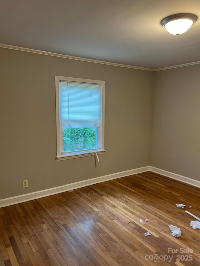 755 Victory Grove Church Rd, Lincolnton, NC 28092 - empty room featuring ornamental molding, baseboards, and hardwood / wood-style flooring