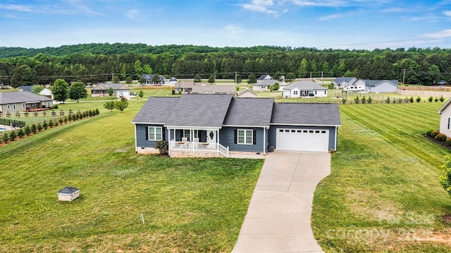 3615 Kimber Ln, Sherrills Ford, NC 28673 - view of front of home with covered porch, an attached garage, driveway, and a front yard