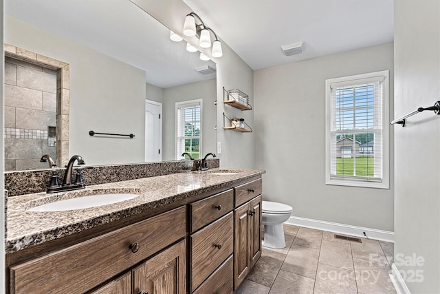 3615 Kimber Ln, Sherrills Ford, NC 28673 - bathroom featuring a sink, baseboards, toilet, and visible vents