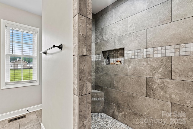 3615 Kimber Ln, Sherrills Ford, NC 28673 - bathroom with baseboards, visible vents, tiled shower, and tile patterned floors