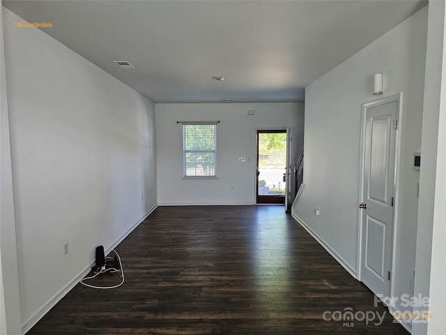 106 Calderdale Ln, Charlotte, NC 28262 - unfurnished room with baseboards, dark wood finished floors, and visible vents