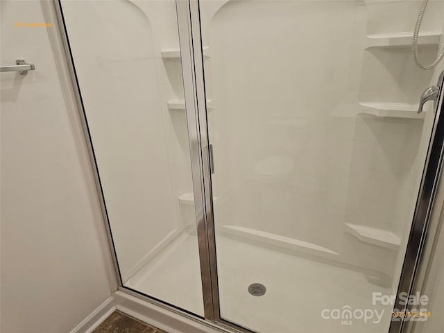 106 Calderdale Ln, Charlotte, NC 28262 - bathroom featuring baseboards and a stall shower