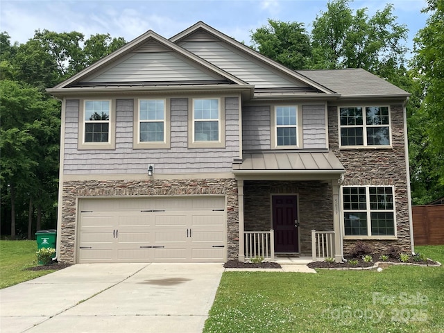 craftsman-style home with a standing seam roof, a garage, stone siding, a front lawn, and concrete driveway