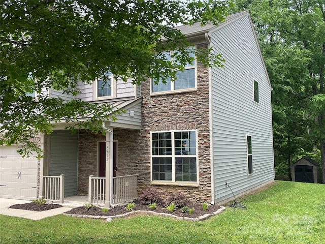 view of front of home with a storage unit, a front yard, and stone siding