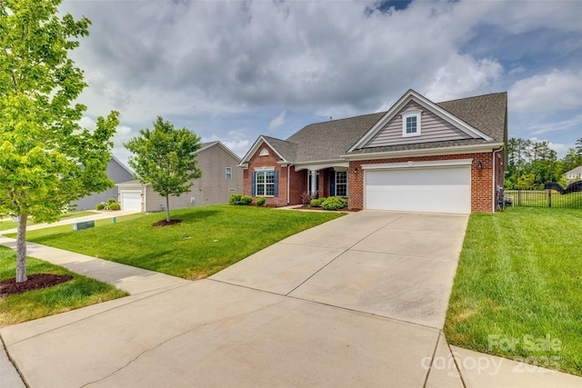 4926 Trayton Ave, Gastonia, NC 28056 - view of front of property featuring fence, a front yard, brick siding, concrete driveway, and an attached garage