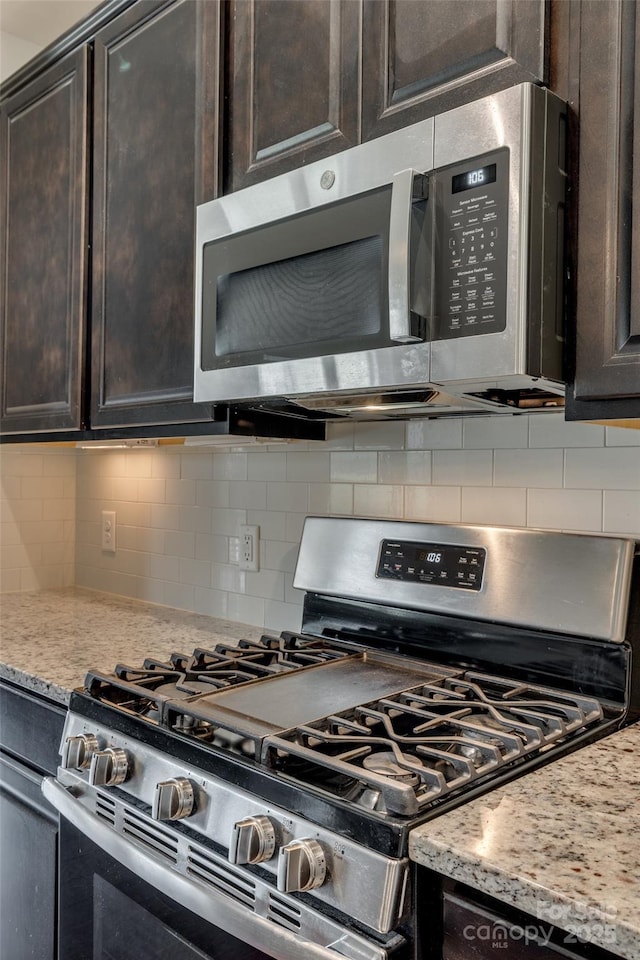 4926 Trayton Ave, Gastonia, NC 28056 - kitchen with backsplash, stainless steel appliances, and dark brown cabinetry